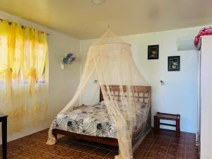 Ένα ή περισσότερα κρεβάτια σε δωμάτιο στο Pintuyan Dive Resort