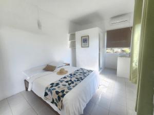 Uma cama ou camas num quarto em Kap Soley - Ile Rodrigues