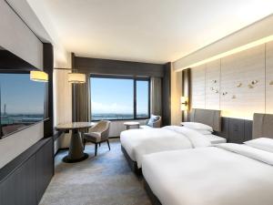 Grand Prince Hotel Osaka Bay客房内的一张或多张床位