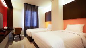 Voodi või voodid majutusasutuse Grand Picasso Hotel toas