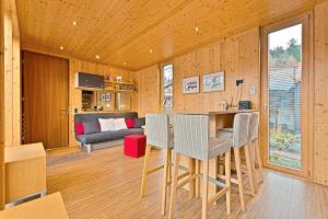 a living room with a table and chairs and a couch at KleinHOTEL Biedenkopf in Biedenkopf