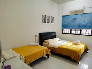 Postel nebo postele na pokoji v ubytování Yajju Homestay 雅居民宿