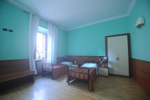 En eller flere senge i et værelse på Hostel Beauty