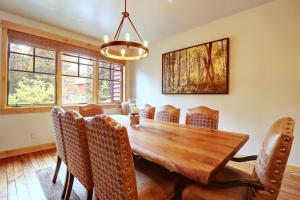 a dining room with a wooden table and chairs at 39C Union Creek Townhomes West Townhouse in Copper Mountain