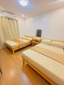 Postel nebo postele na pokoji v ubytování Natural Hotspring resort + 13 fotografií