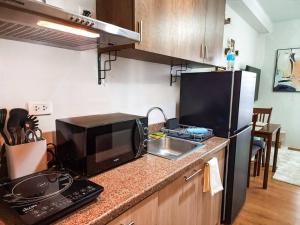 Η κουζίνα ή μικρή κουζίνα στο TJ Urban Living - Studio Unit at Mesatierra Davao