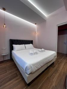 Postel nebo postele na pokoji v ubytování Adalesia Hotel & Coffee
