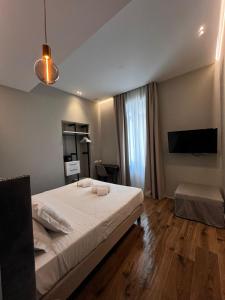 Postel nebo postele na pokoji v ubytování Adalesia Hotel & Coffee