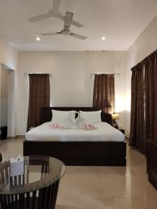 Voodi või voodid majutusasutuse Aroma Ayur Heritage toas