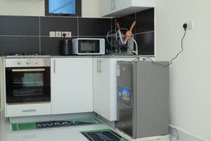 Kuchyň nebo kuchyňský kout v ubytování Luxore Residence, Syokimau