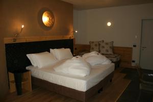 Postel nebo postele na pokoji v ubytování Hotel Orso Grigio