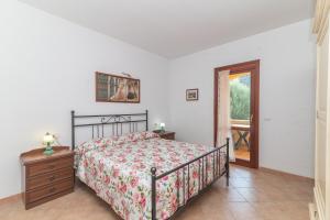 Postel nebo postele na pokoji v ubytování Casa Vacanza San Teodoro