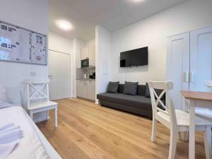 TV a/nebo společenská místnost v ubytování AM1026 - Smarte Monteurwohnung Übergangswohnung