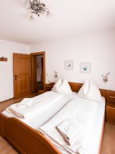 Posteľ alebo postele v izbe v ubytovaní Auerschmied Appartements