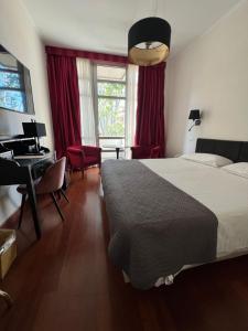 Postel nebo postele na pokoji v ubytování Hotel Fenix