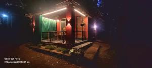 a small house at night with lights on it at Niramaya beach view stay in Gokarna