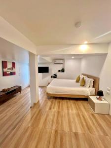 a large bedroom with a bed and wooden floors at patong sunset villa Phuket in Patong Beach +51 photos