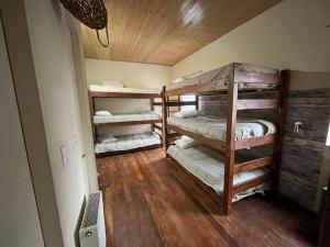 a room with two bunk beds in a room at Hotel Nativo in Santiago
