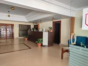 a lobby of a hotel with a reception desk at Hotel Badami Court in Badami +35 photos