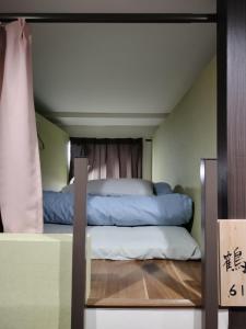Vuode tai vuoteita majoituspaikassa 駿府城下町の宿　玉乃屋