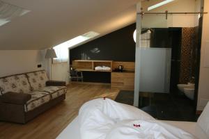 Postel nebo postele na pokoji v ubytování Hotel Orso Grigio