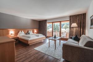 Postel nebo postele na pokoji v ubytování Hotel Reischach