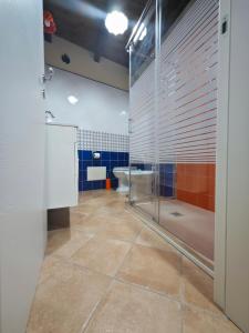 a bathroom with a glass shower and a toilet at Vestigia Pompeiana in Pompei +39 photos