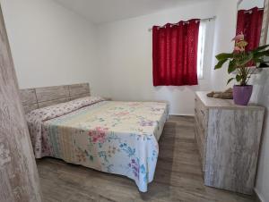 Postel nebo postele na pokoji v ubytování Appartamento Las Palmas