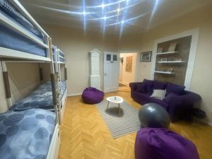 a living room with a bunk bed and a couch at FG Boutique Hostel in Sarajevo