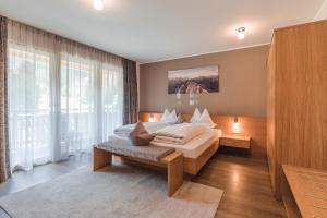Postel nebo postele na pokoji v ubytování Hotel Reischach