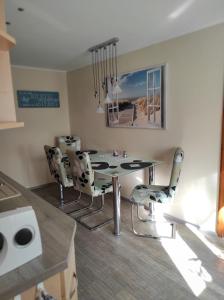 a dining room with a table and chairs at Quartier Torno in Torno +11 photos