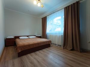 Postel nebo postele na pokoji v ubytování Сільська Садиба