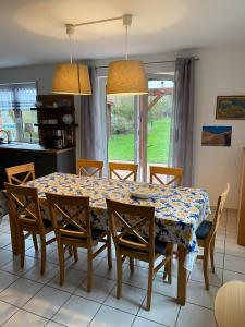 a dining room with a table and chairs at Haus Petra in Borkum