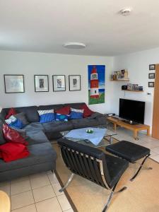 a living room with a couch and a table at Haus Petra in Borkum