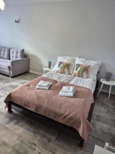 Posteľ alebo postele v izbe v ubytovaní Górski Apartament