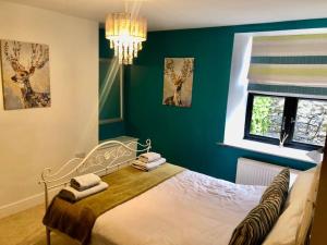 Ένα ή περισσότερα κρεβάτια σε δωμάτιο στο Cosy holiday home in the heart of Buxton