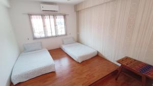 Postel nebo postele na pokoji v ubytování Jonker Sayang Residence
