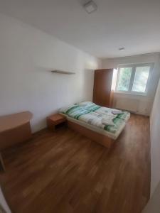 Postel nebo postele na pokoji v ubytování Danubius Szálló