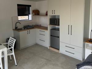 Una cocina o cocineta en Protea32