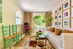 a living room with a couch and a table at Cape Standard Guest House in Cape Town +21 photos