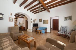 a living room with couches and a table at San Sole in Vilafranca de Bonany