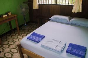 Un ou plusieurs lits dans un hébergement de l'établissement Hostel Casa de las Palmas Tours