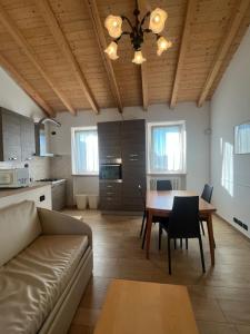 a living room with a couch and a table at Apartments Colombara Bardolino in Bardolino