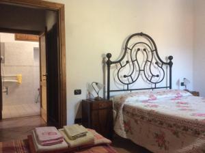 A bed or beds in a room at Agriturismo Podere Fiume