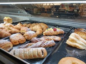 a display case with many different types of pastries at Intrecci B&B in Terlizzi