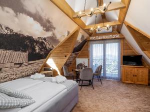 Posteľ alebo postele v izbe v ubytovaní Apartamenty Małe Ciche z jacuzzi ogrodowym, widokiem na TATRY i SKY WALK