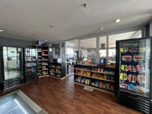 a grocery store aisle with a lot of products at Alphaville-Industrial com cozinha-piscina e academia-500mega in Barueri