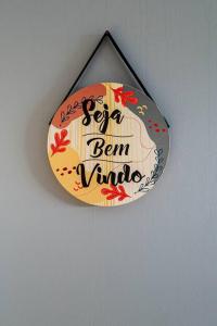 a sign that says ker ker ben virus hanging on a wall at Alphaville-Industrial com cozinha-piscina e academia-500mega in Barueri