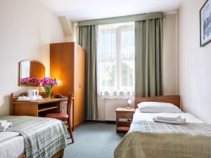 Postel nebo postele na pokoji v ubytování Hotel Galicya