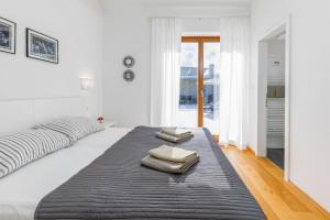 a bedroom with a large bed with two pillows on it at Villa Terra Nera in Sveti Petar u Šumi +43 photos